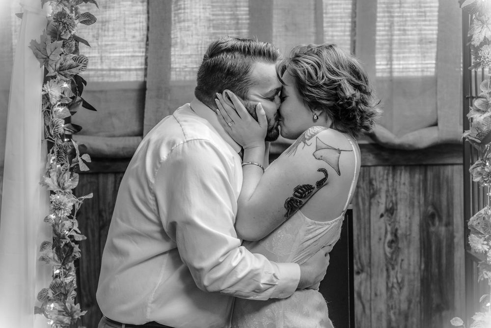 Black and white photograph of an engaged couple kissing, engagement photography by Campbell Shepard, Frederick, MD
