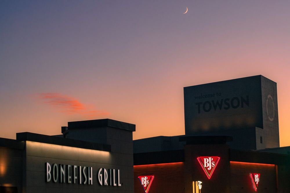 Crescent moon over the Towson skyline at dusk, fine art landscape photograph by Campbell Shepard