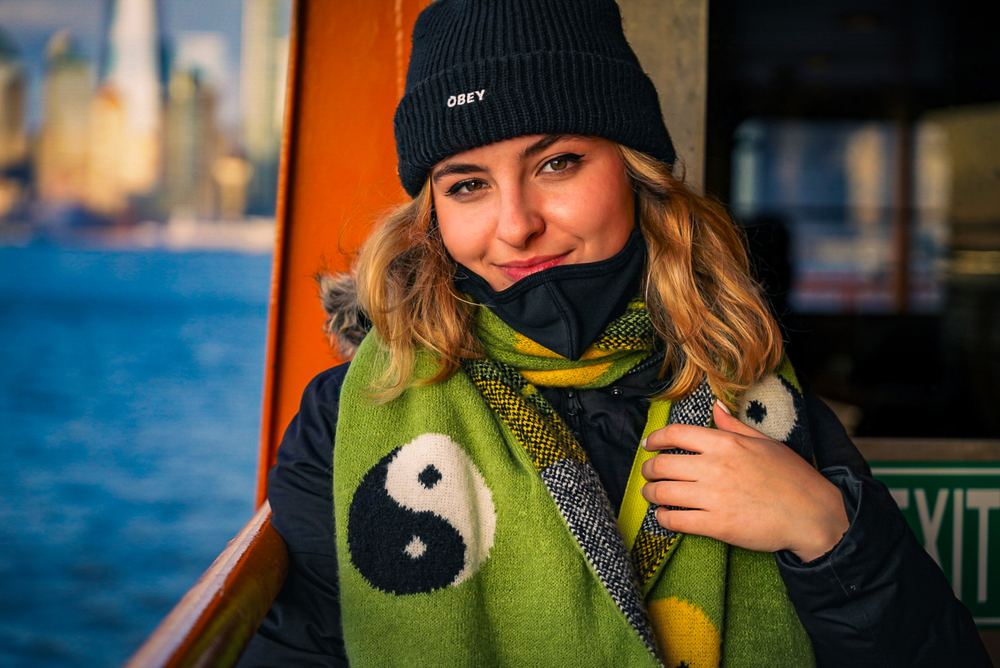 Waterfront portrait of Astrid wearing a beanie and scarf, portrait photography by Campbell Shepard, Frederick, MD