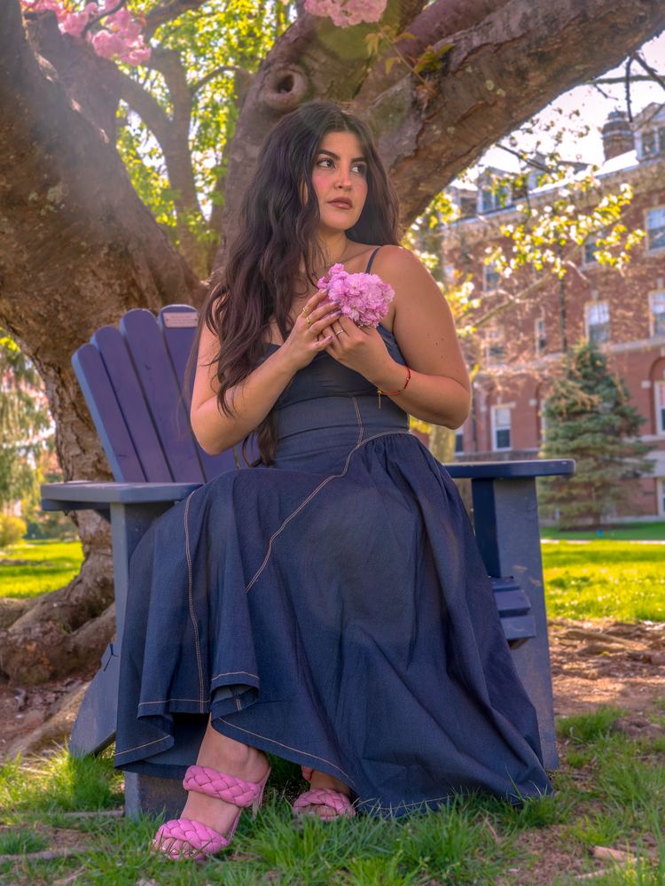 Meli in a navy dress seated beneath a tree, outdoor portrait by Campbell Shepard, Frederick, MD