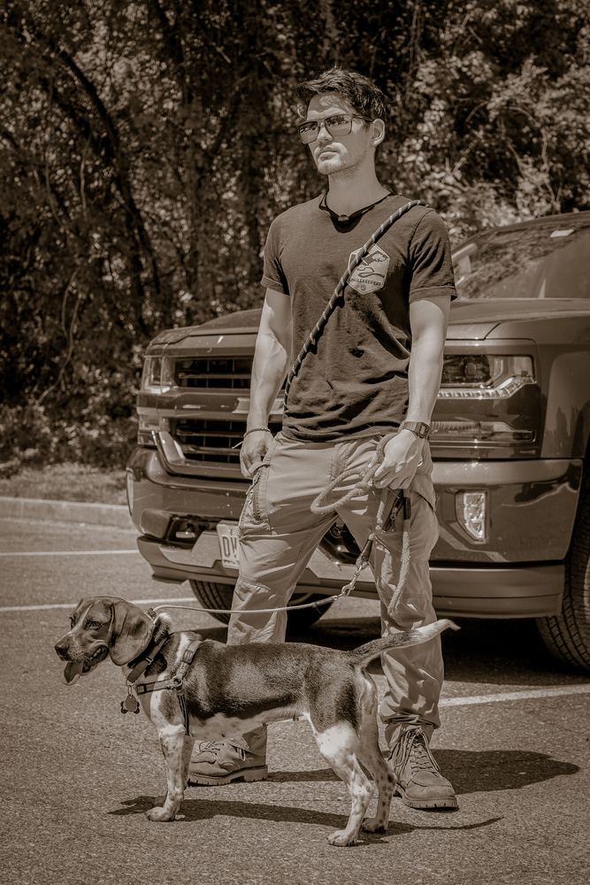 Sepia lifestyle portrait of Andrei with his dogs, brand and lifestyle photography by Campbell Shepard, Frederick, MD
